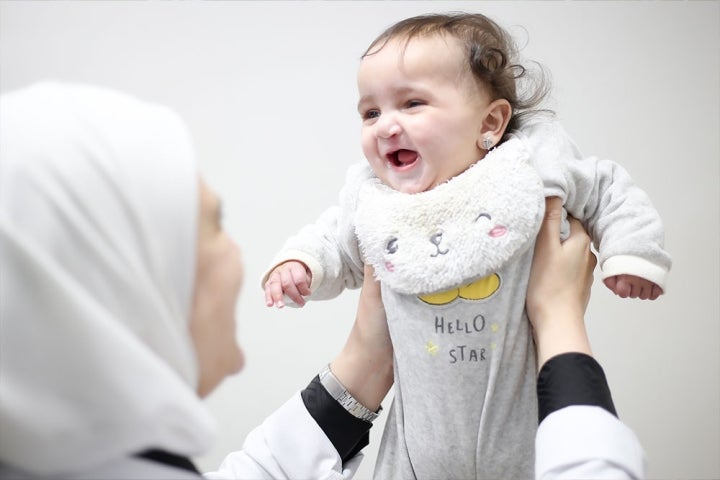 Misk being held in the air