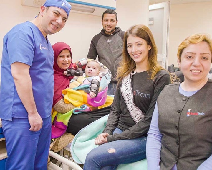 Smile Train supporters and staff with patient